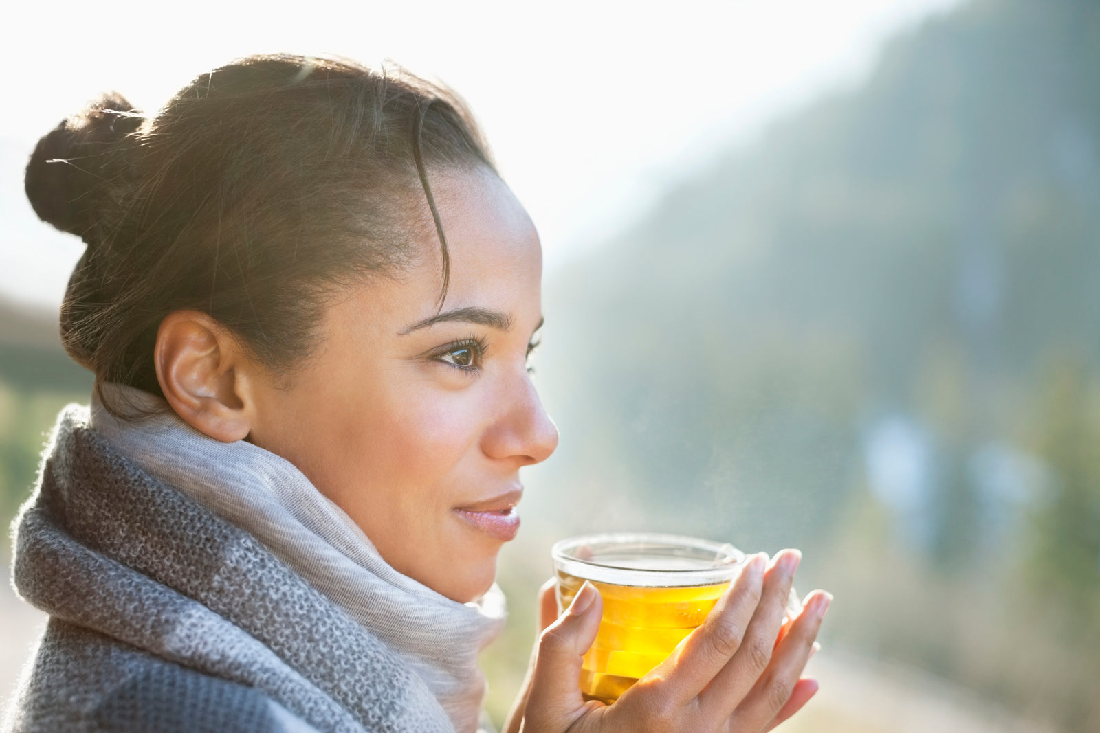 woman holding a cup of tea