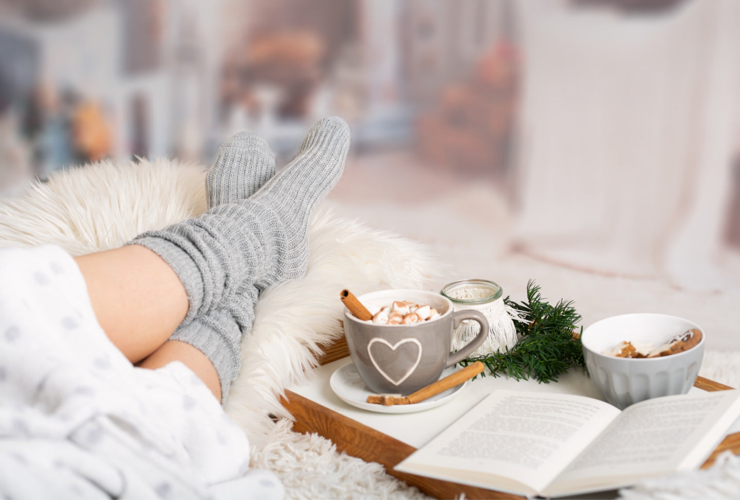 person relaxing with a book and snacks