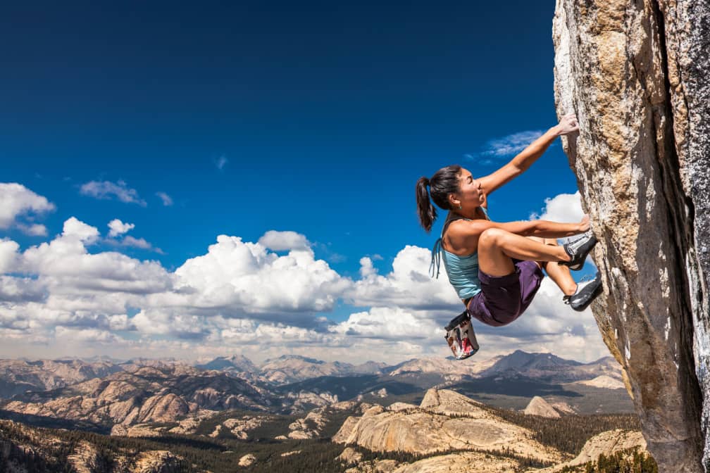 woman rock climbing